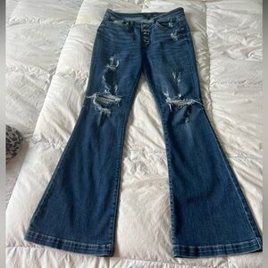 Judy Blue jeans with rips and flared bottoms. Size 11/30. EUC